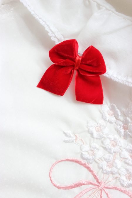 Czerwona kokardka do wózka